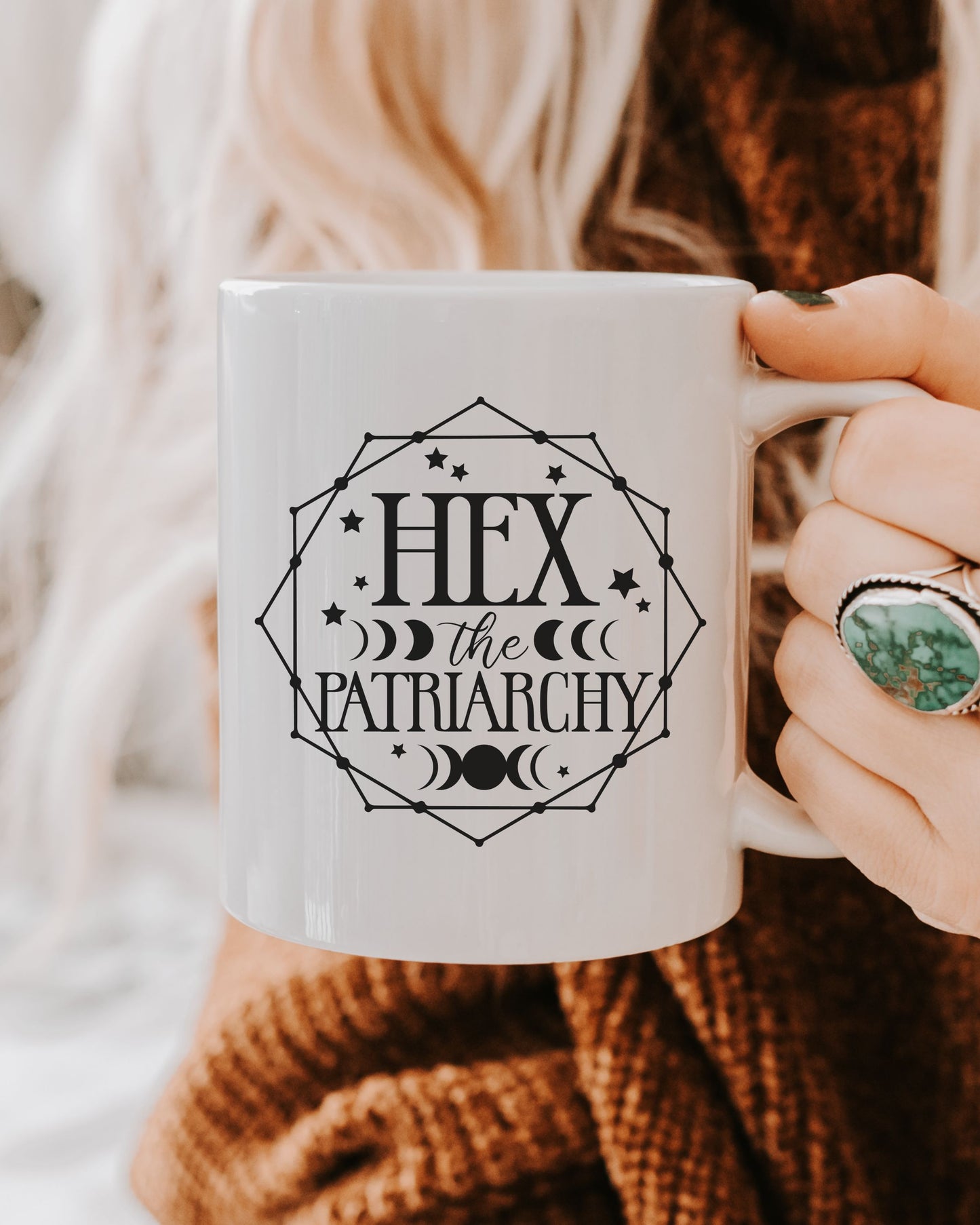 Person holding a mug with 'Hex the Patriarchy' text