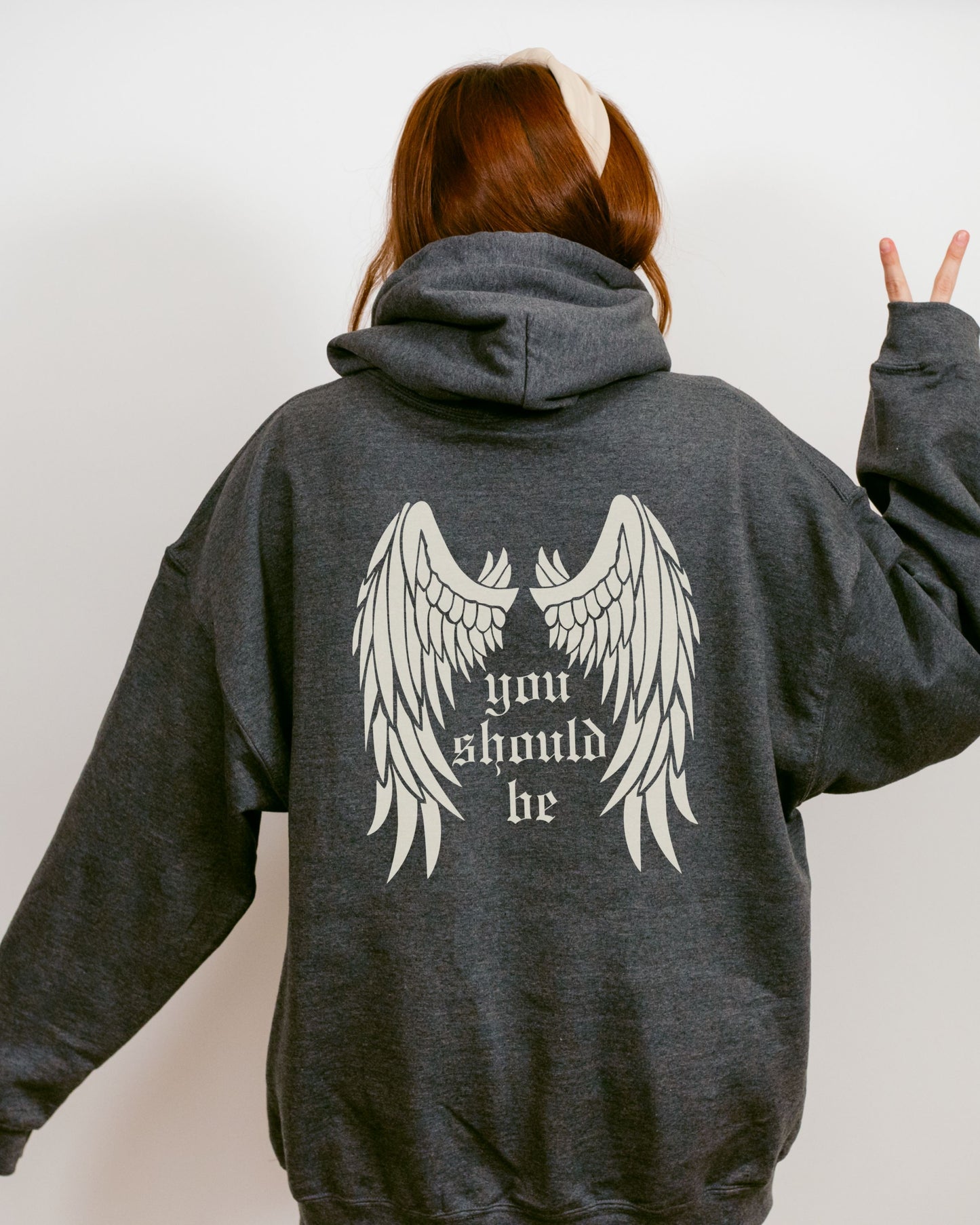 woman wearing who’s afraid of little old me hoodie, relaxed oversized fit