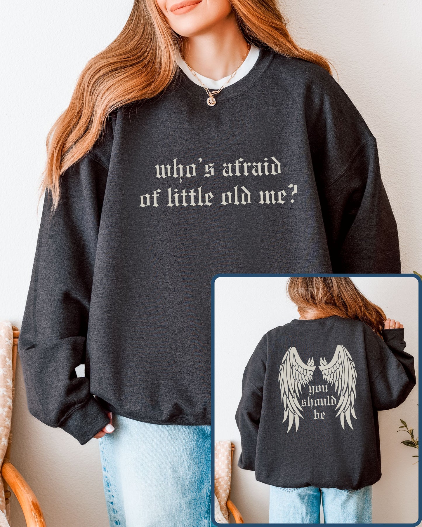 Person wearing a black sweatshirt with text, shown front and back.