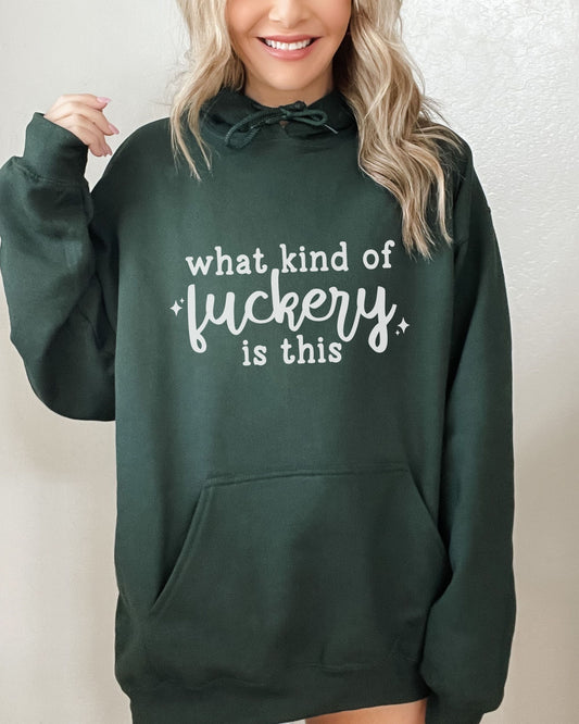Person wearing a green hoodie with text on a plain background