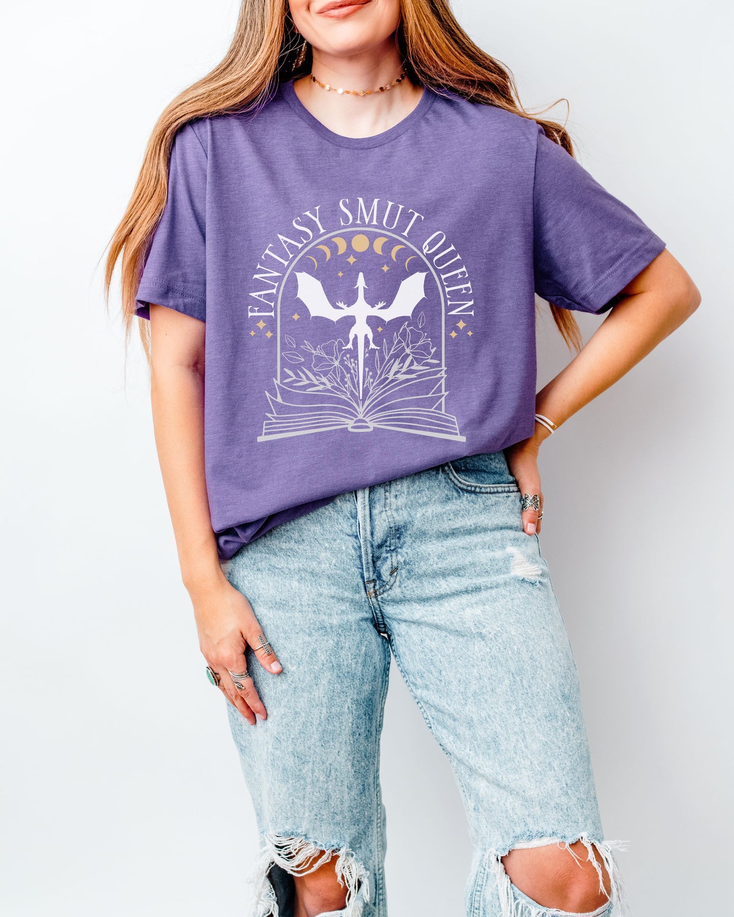 Person wearing a purple t-shirt with a graphic design and text, standing against a plain background.