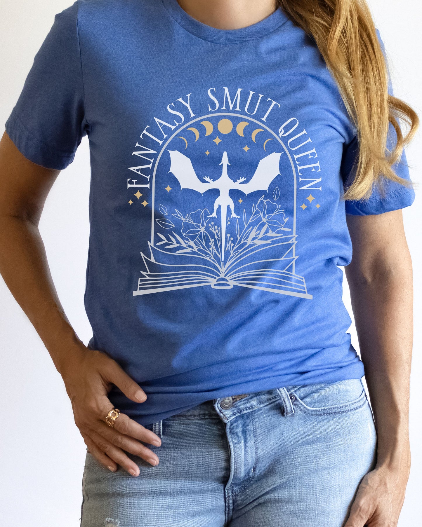 Person wearing a blue t-shirt with 'Fantasy Smut Queen' design on a white background