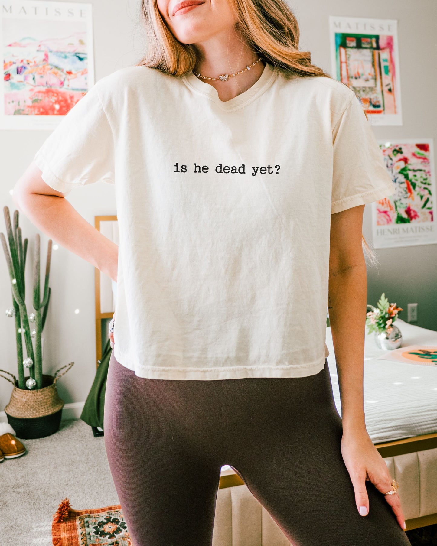 woman wearing is he dead yet dark humor crop top