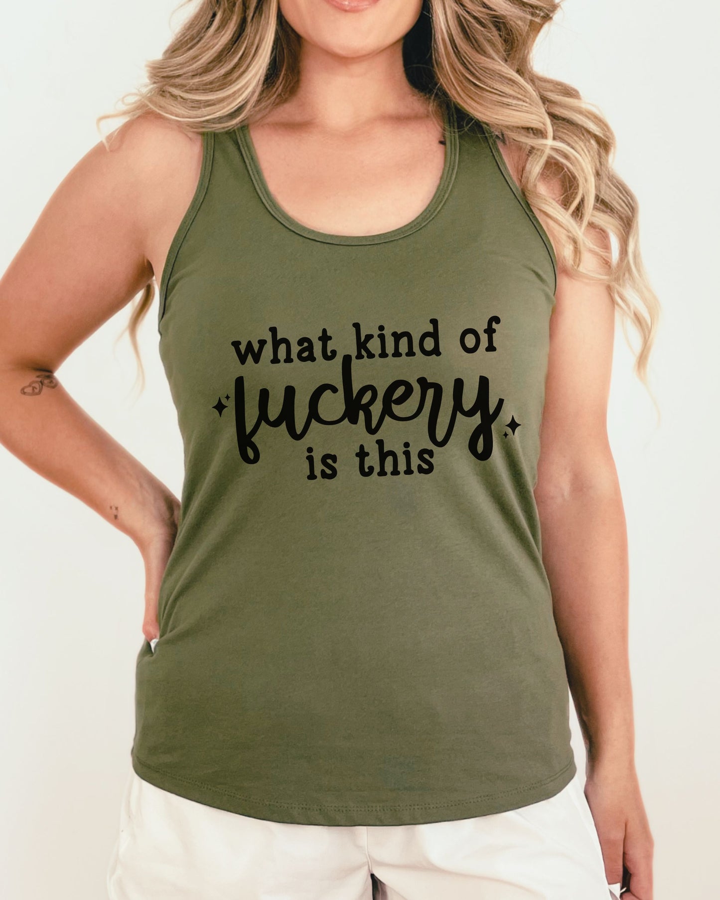 Person wearing a green tank top with text on a plain background