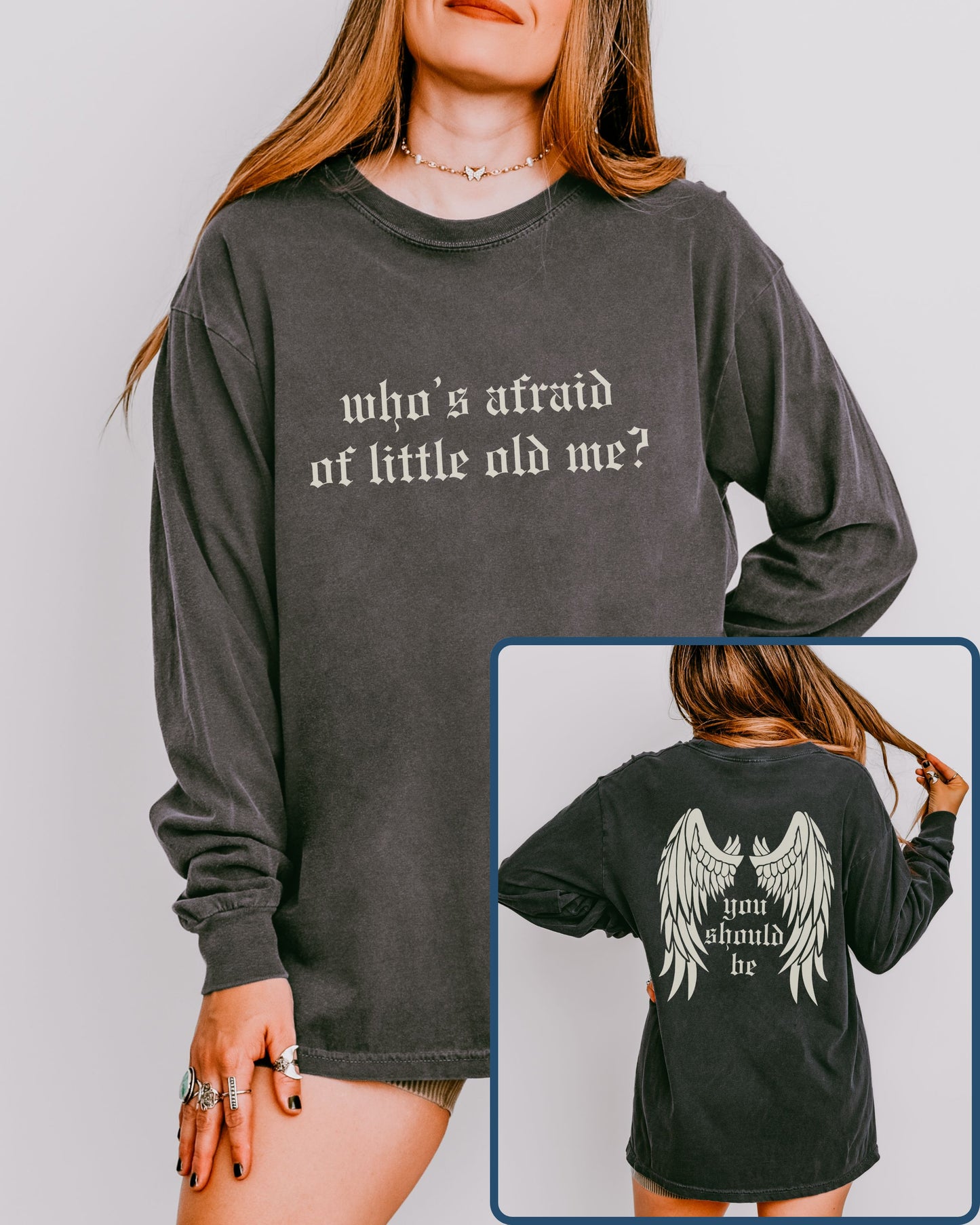 Person wearing a long-sleeve shirt with text on the front and back, against a plain background.