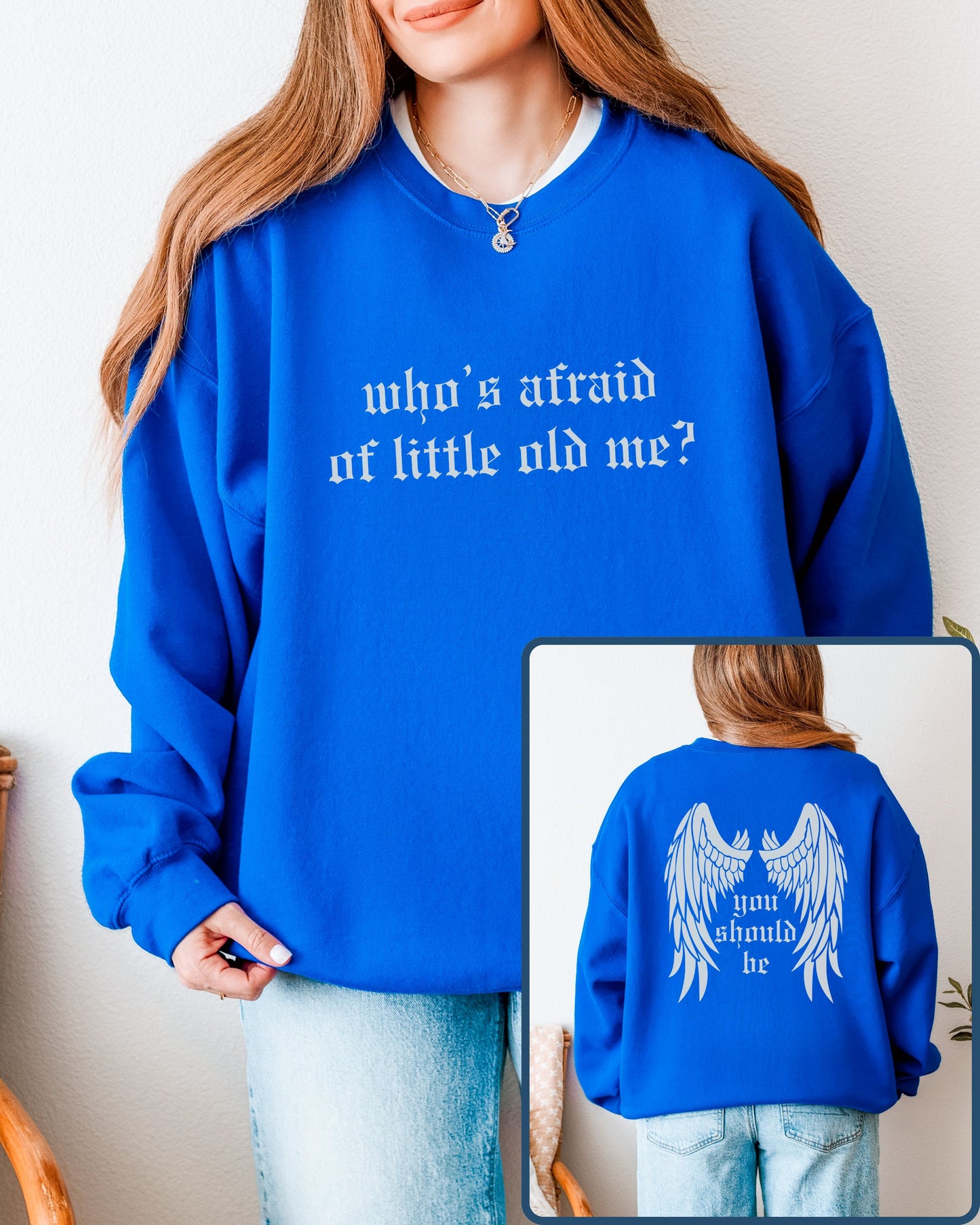 Person wearing a blue sweatshirt with text, shown from front and back.