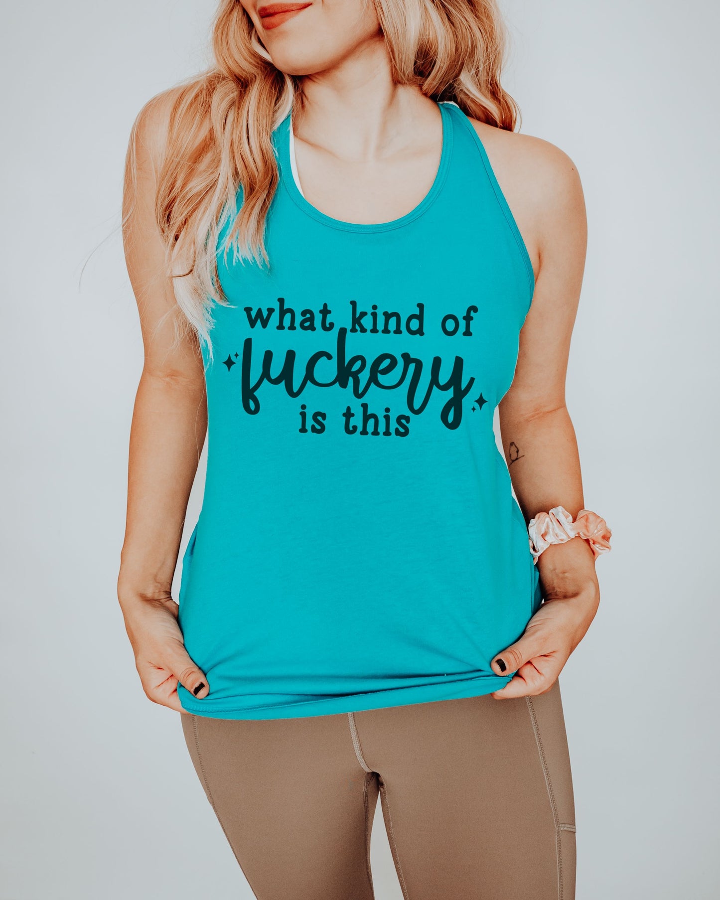 Person wearing a turquoise tank top with text on a plain background