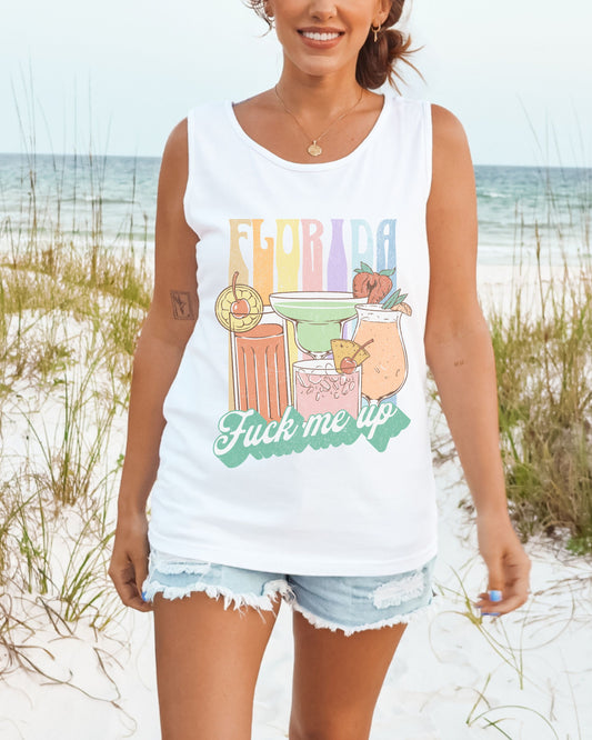 Woman wearing a white tank top with a colorful 'Florida' graphic on a beach.
