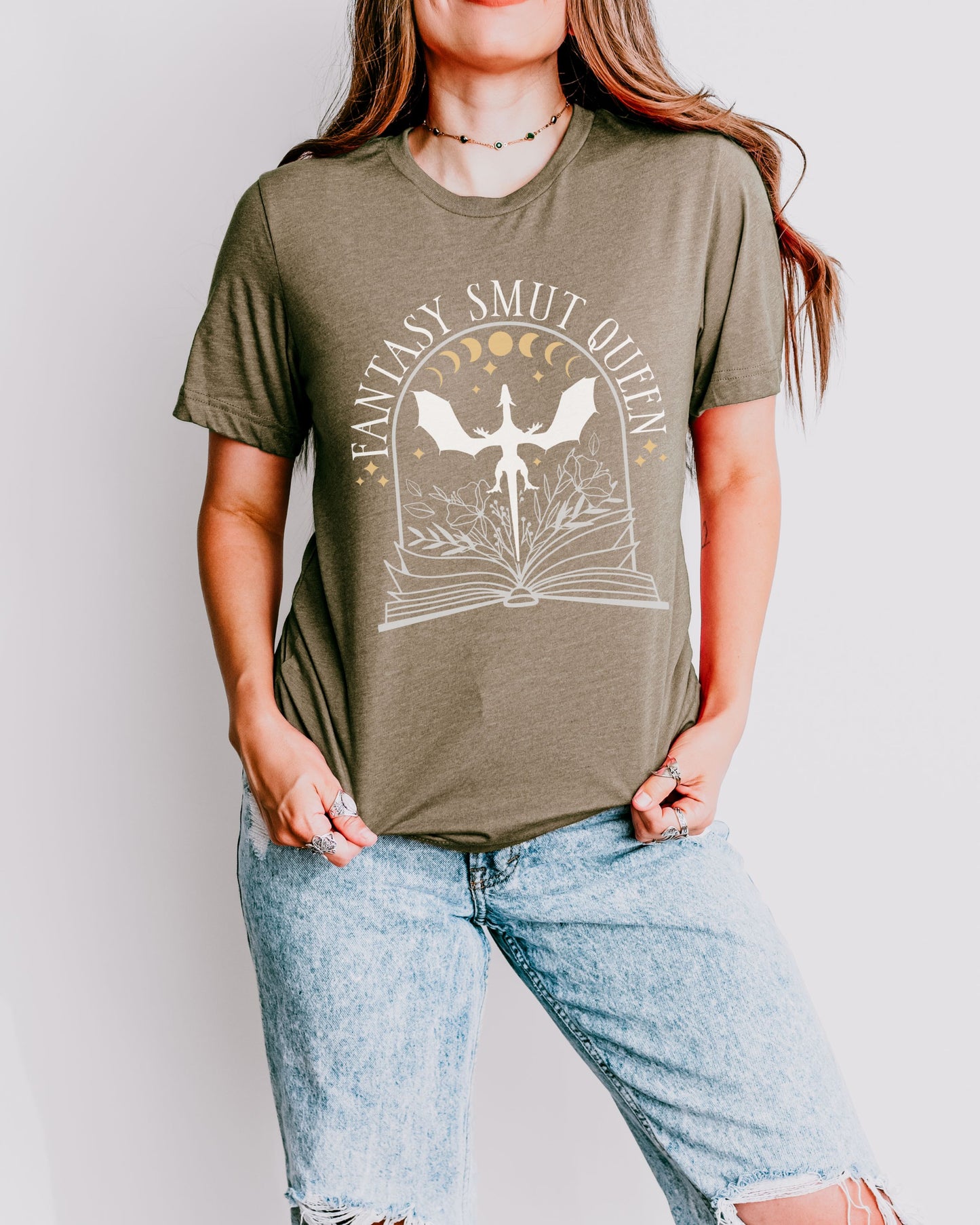 Person wearing a green t-shirt with 'Fantasy Smut Queen' graphic design.