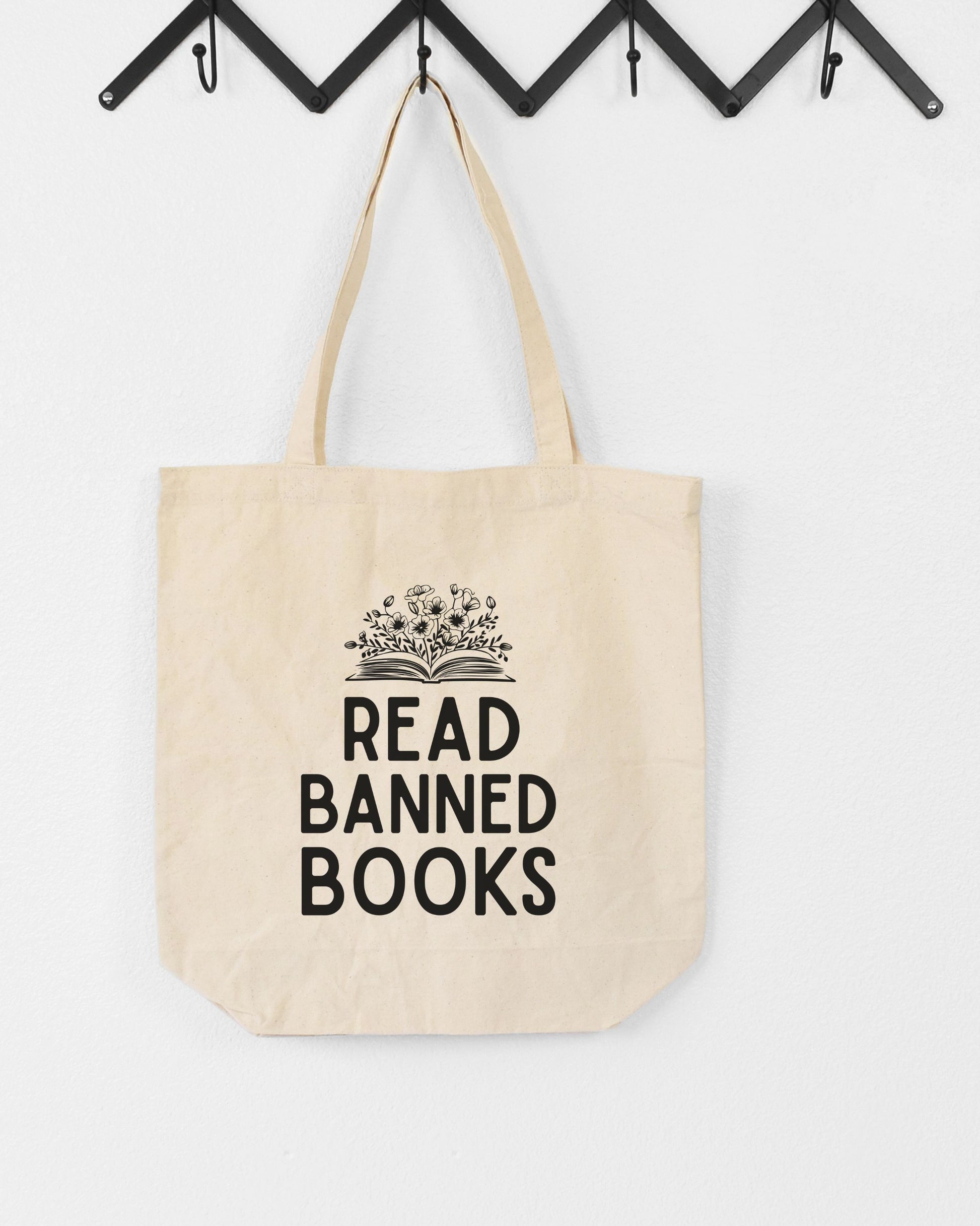 Beige tote bag with 'Read Banned Books' text on a white background