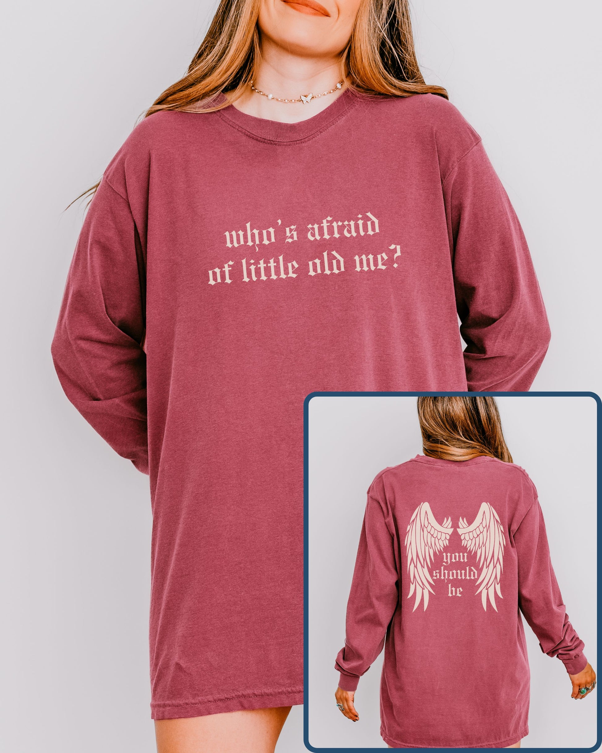 Maroon long-sleeve shirt with text on a plain background