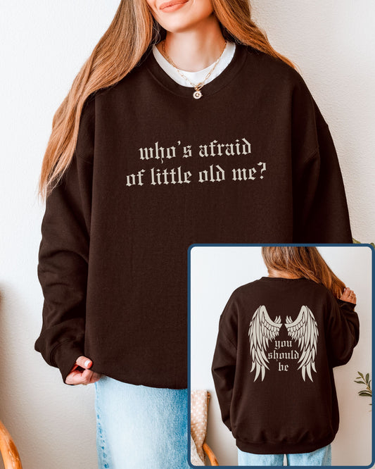 Person wearing a brown sweatshirt with text, shown from front and back.