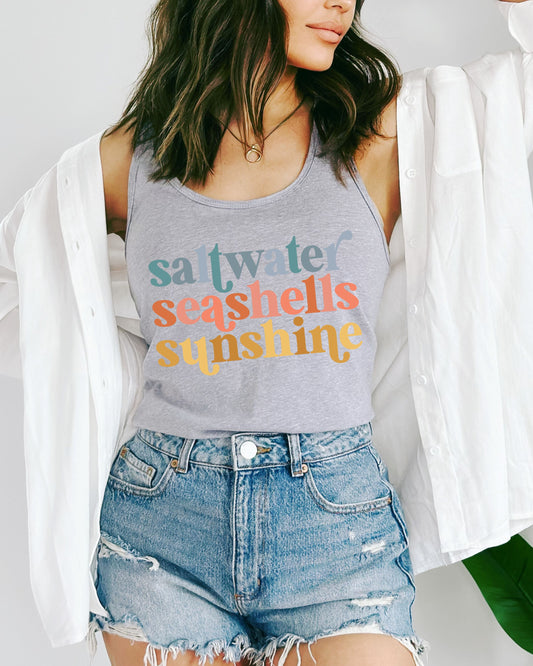 woman wearing summer tank top with saltwater seashells sunshine text
