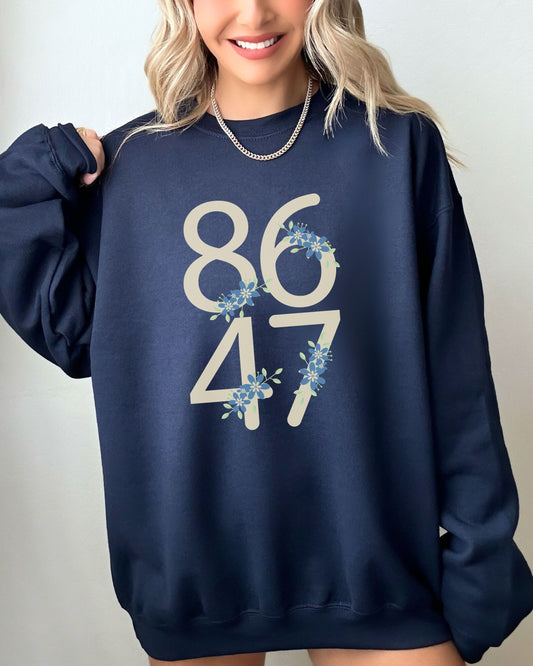 Navy blue sweatshirt with '8647' design worn by a person