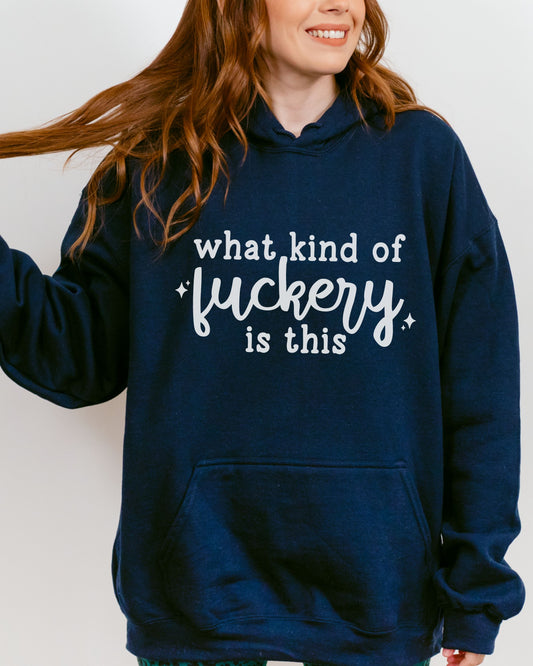 Person wearing a navy hoodie with white text on a plain background