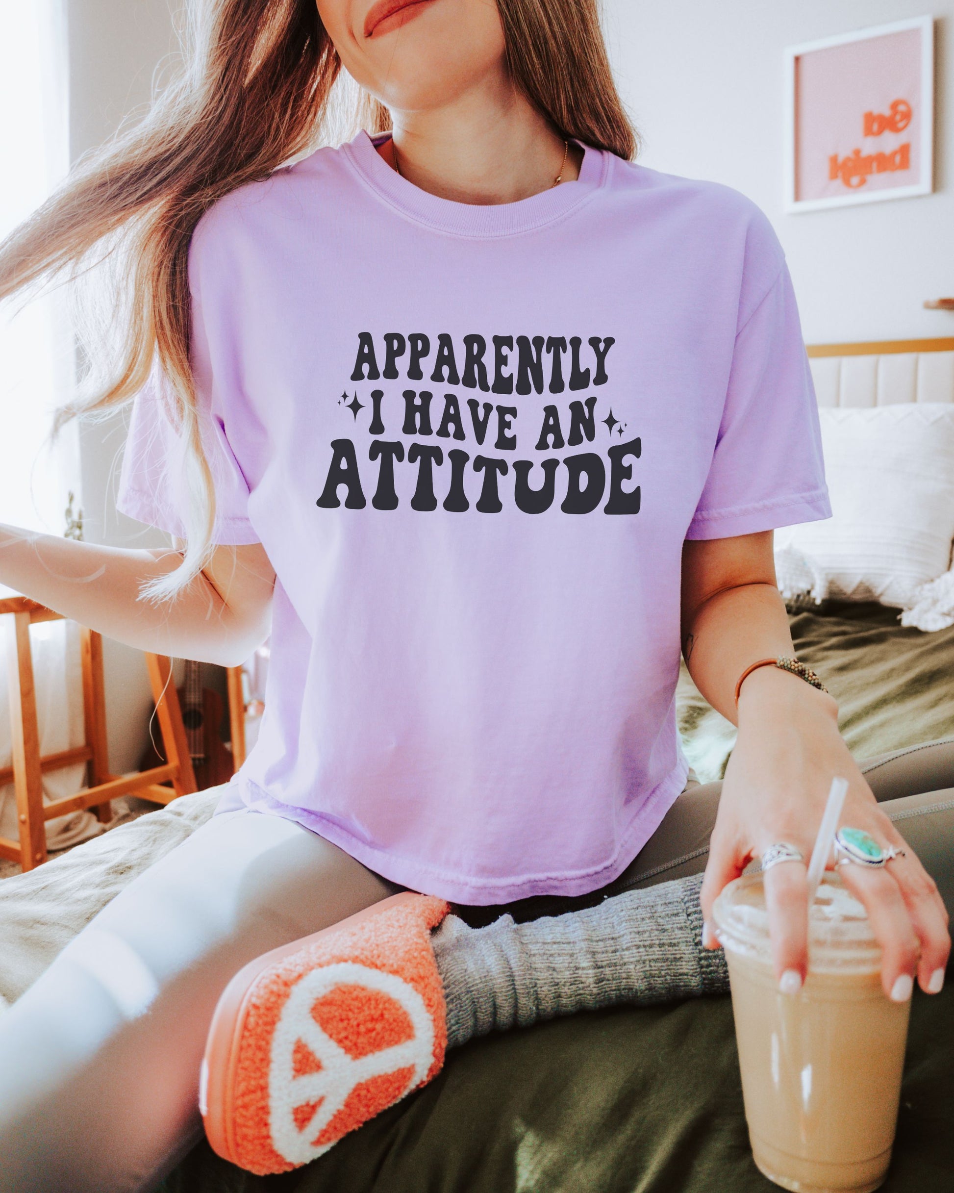 woman wearing sarcastic attitude shirt in retro font
