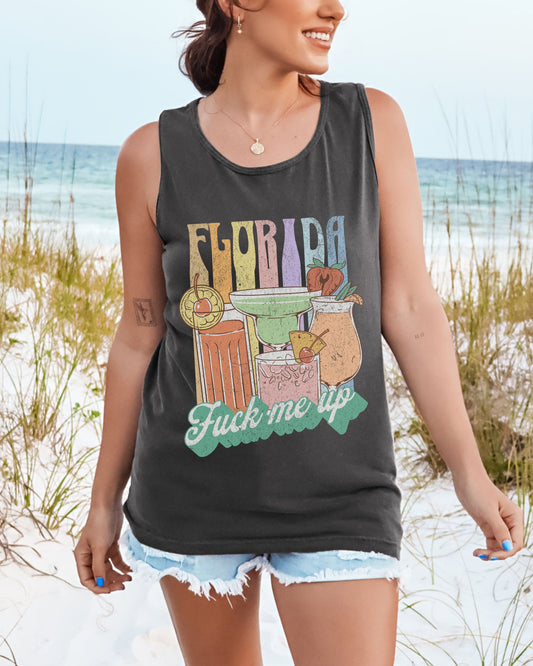 Woman wearing a tank top with 'Florida' graphic on a beach