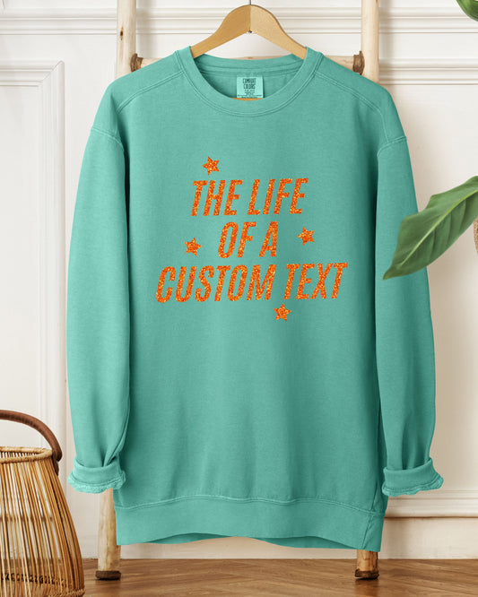 The Life Of A… Custom Sweatshirt – Comfort Colors Glitter-Effect Personalized Crewneck