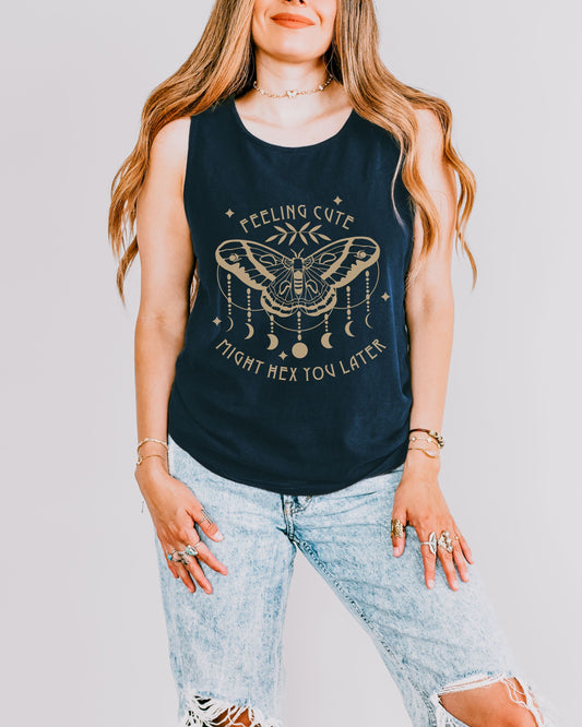Woman wearing a navy tank top with a graphic design and text.