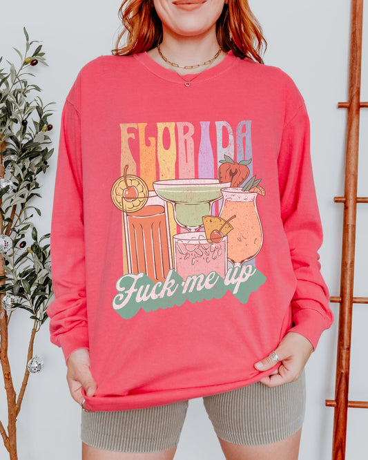 Person wearing a pink sweatshirt with a colorful 'Florida' graphic and text.