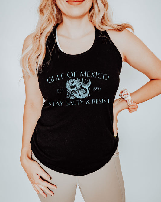Person wearing a black tank top with Gulf of Mexico design and text.